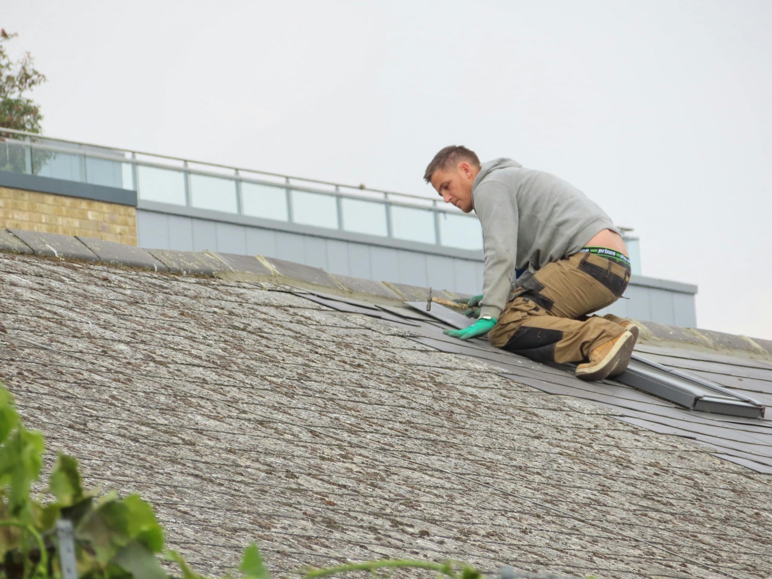man fixing a roof